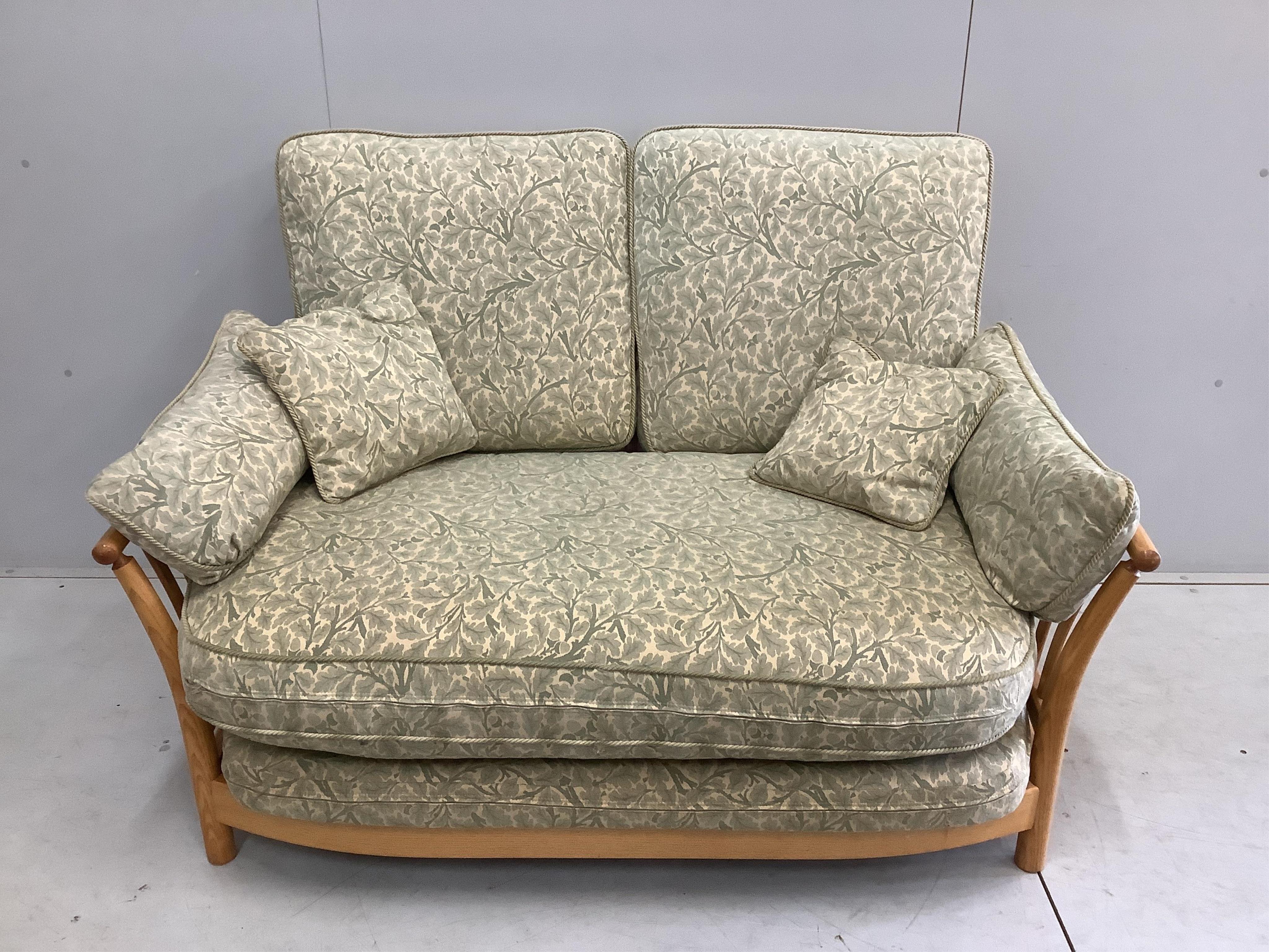 An Ercol ash 'Renaissance' two seater settee, width 144cm, depth 90cm, height 96cm